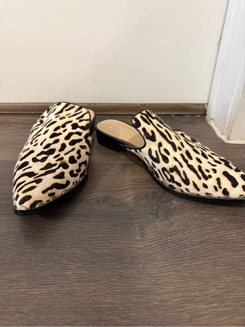 Bleecker & Bond cheetah print mules. Accented with studded soles